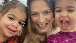 Teacher and two kids posing together