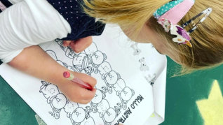 Girl coloring a drawing