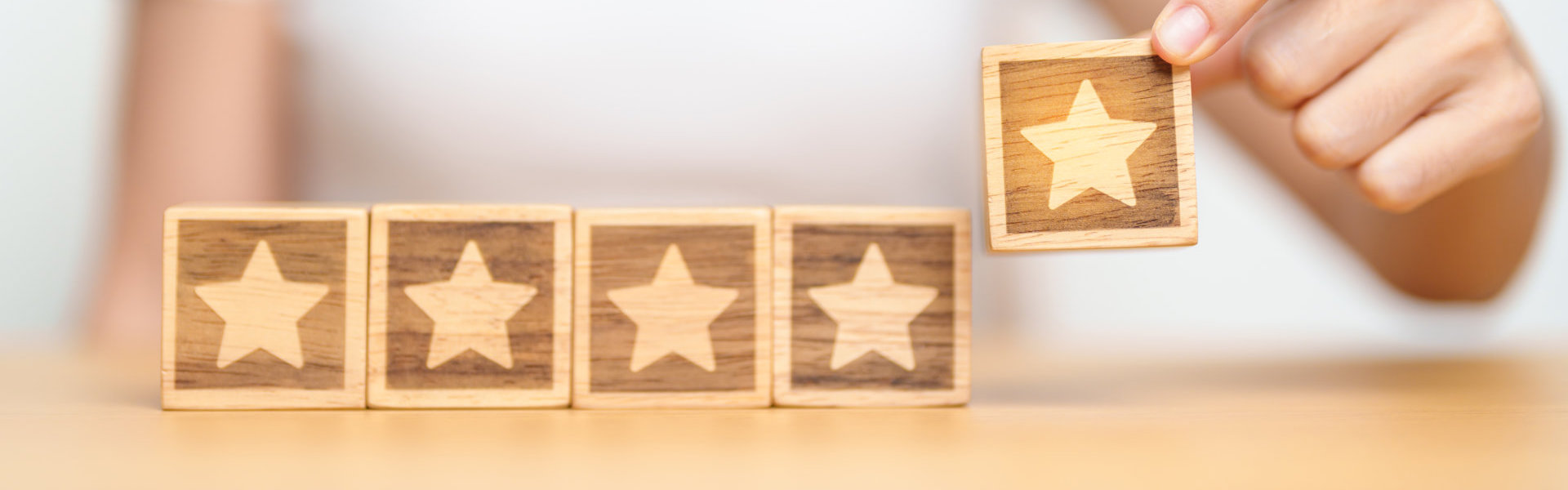 Close up shot of a woman holding a building block with star shape