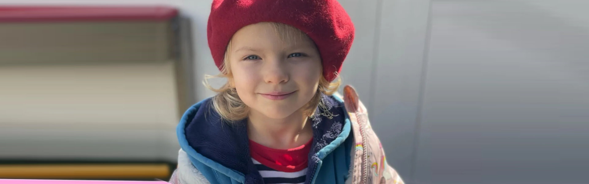 Young child wearing a red beret