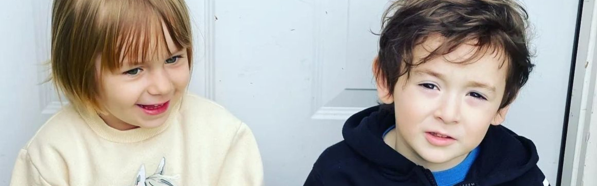 Two boys smiling at the camera